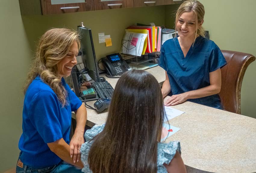 Mom and daughter having a consult with a dental hygenist