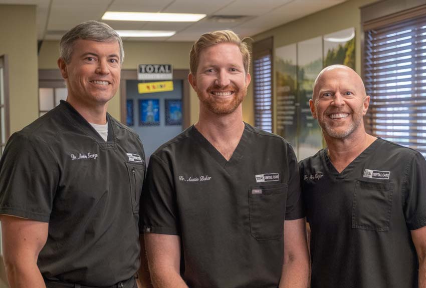 Group protrait of our three dentists in the Total Dental Care lobby
