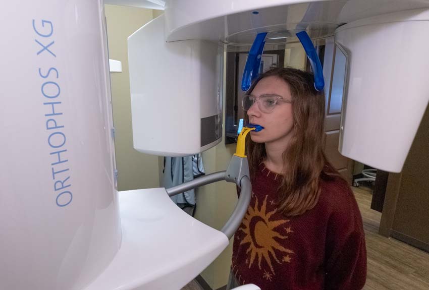 teenaged girl standing for a dental x-ray